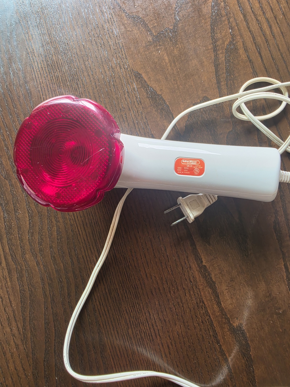 Handheld infrared heat lamp.